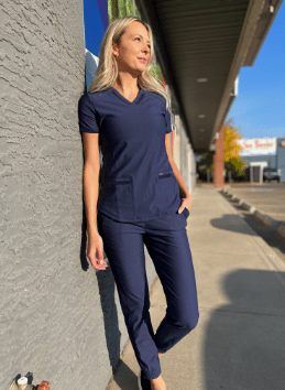 https://myscrubs.ca/wp-content/uploads/2022/11/my_scrubs_lady_wearing_stretch_vneck_top_navy.png
